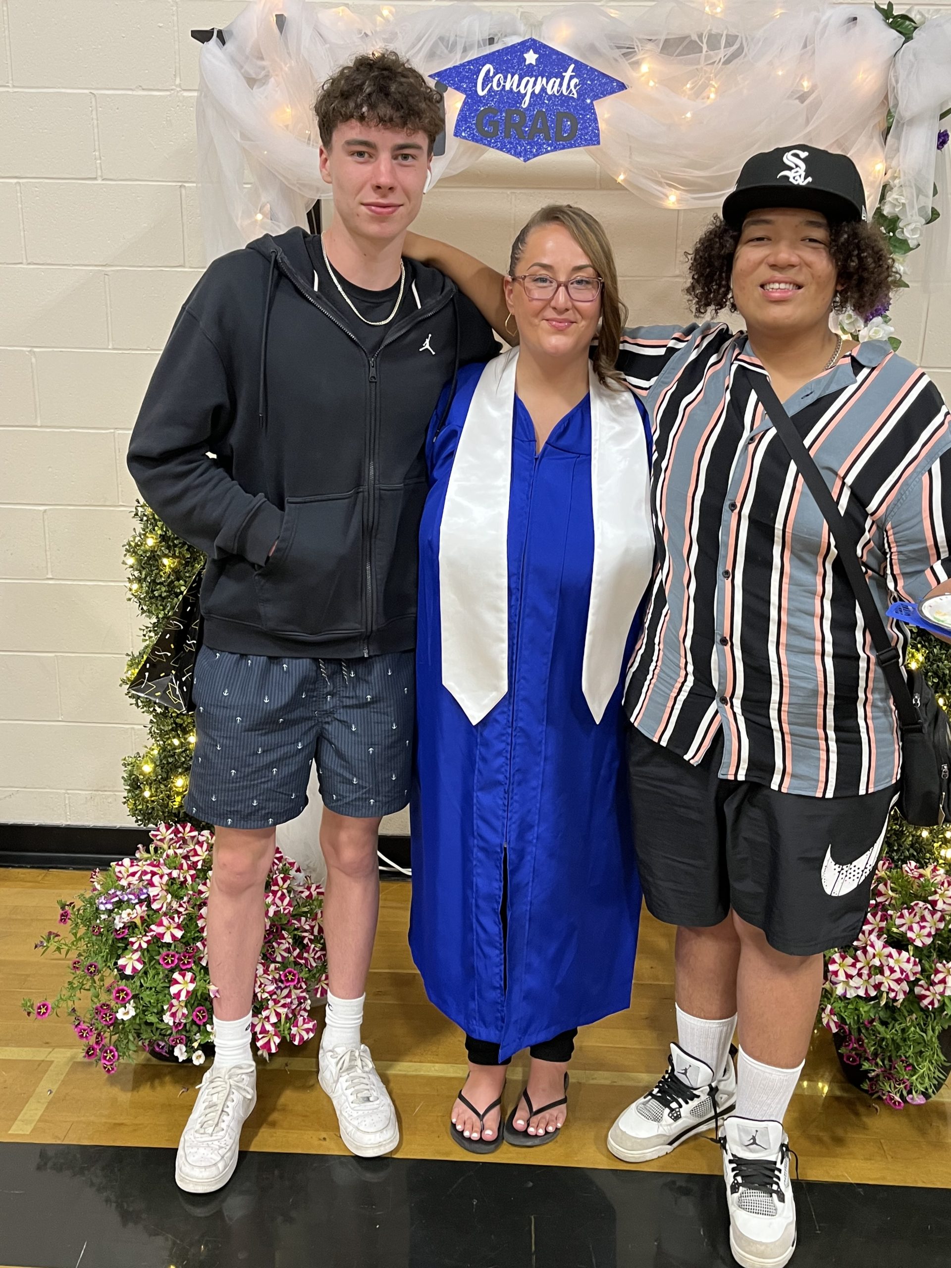 Channi Gonzales at her graduation from the Continuing Education program in 2023 with her sons.