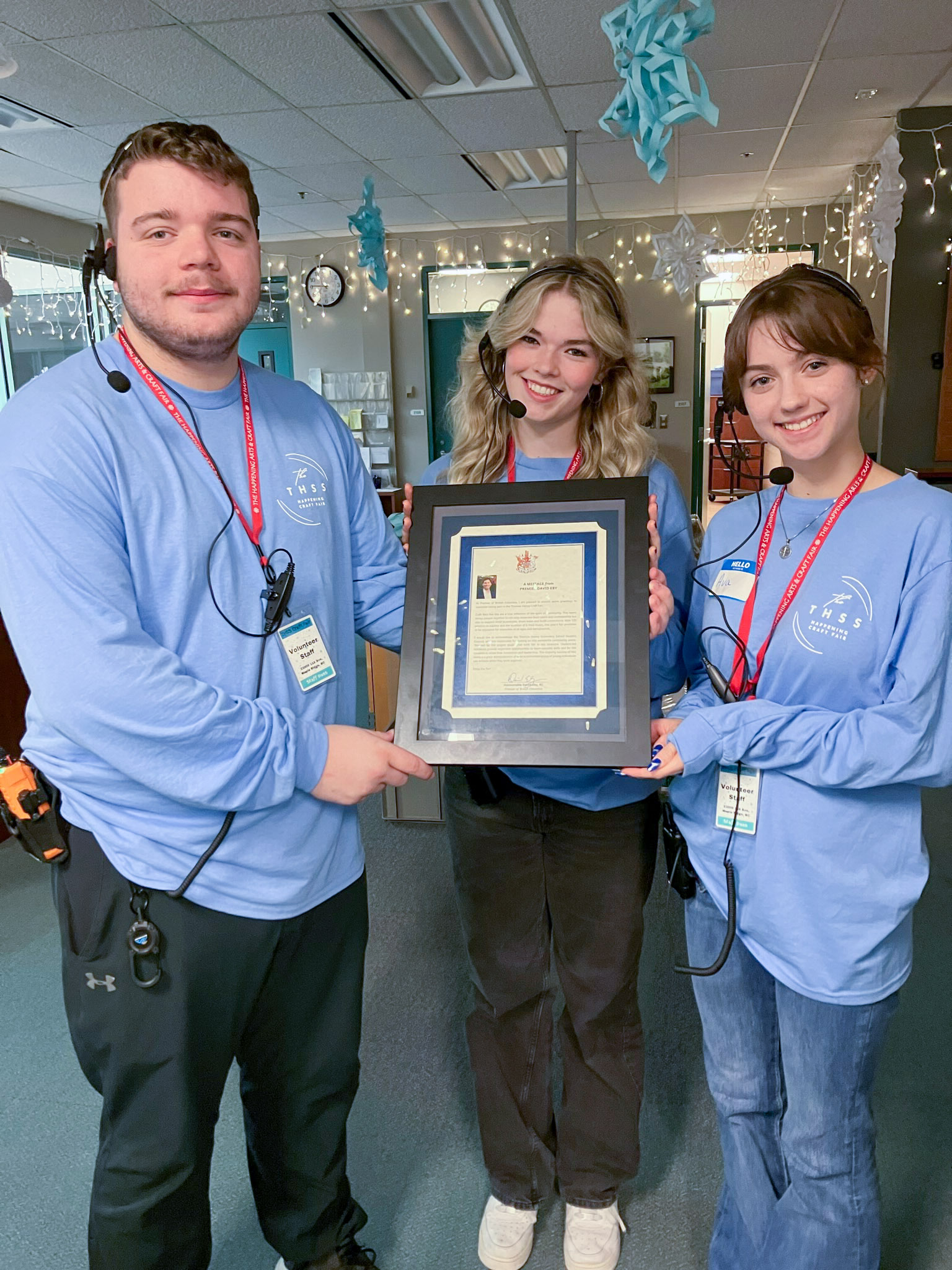 THSS students hold up the letter they received from Premier David Eby congratulating them on their success.